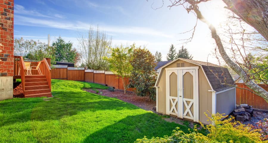 Fenced backyard with storage shed in Oceanside